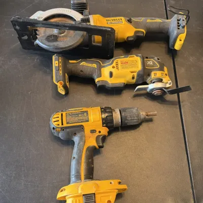 Sale Photo Thumbnail #11: Cordless DeWalt power tools including a circular saw, an oscillating multi-tool, and a drill