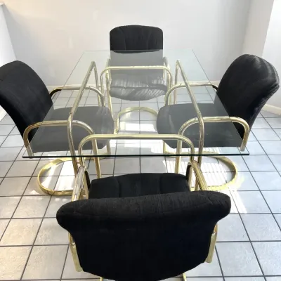 Sale Photo Thumbnail #52: Vintage 1980s brass dining table with rectangular glass top and four matching brass cantilever armchairs with black upholstered seats.