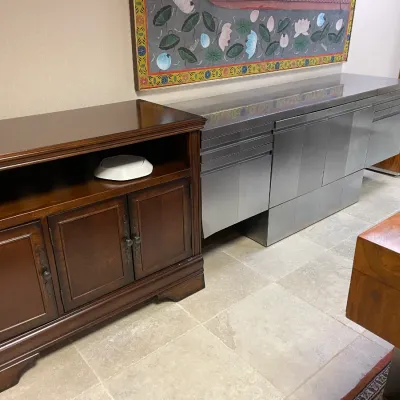 Sale Photo Thumbnail #3: Traditional dark wood buffet server paired with a sleek modern brushed metal credenza, displayed alongside framed Asian artwork.