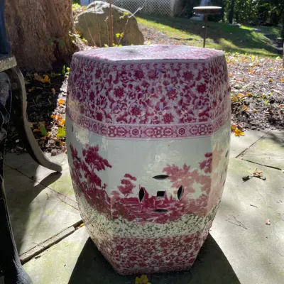 Sale Photo Thumbnail #17: Hexagonal ceramic garden stool featuring a pink transferring landscape and floral pattern with decorative side cutouts.