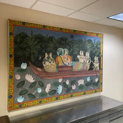 Sale Photo Thumbnail #4: Large framed Indian miniature-style painting depicting Krishna and attendants in a lotus boat, with an ornate floral border.