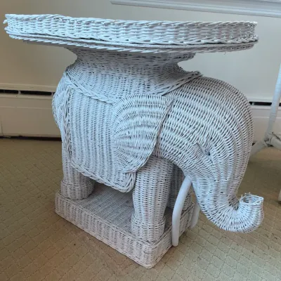 Sale Photo Thumbnail #53: Vintage white woven wicker elephant-shaped accent table featuring an integrated tray top.