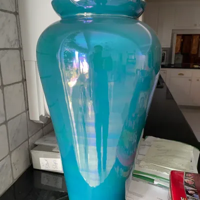 Sale Photo Thumbnail #35: Large turquoise iridescent carnival glass floor vase with a rolled lip.