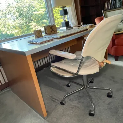 Sale Photo Thumbnail #66: Mid-century modern style executive desk paired with a white leather and chrome swivel office chair.
