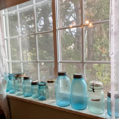Sale Photo Thumbnail #17: Antique blue glass jars and zinc lids