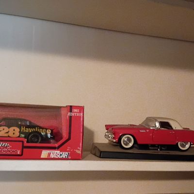 Die-cast scale model vehicles, including a boxed 1993 Racing Champions #28 Havoline stock car and a red classic Thunderbird model on a...
