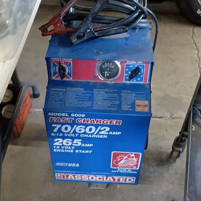 Vintage Associated Model 6009 rolling battery fast charger and engine starter with attached cables.