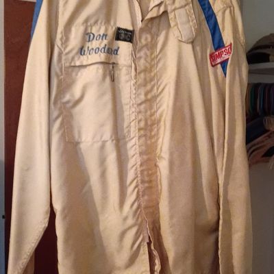 Vintage Simpson racing jacket in off-white with blue shoulder stripes, featuring embroidered name 'Don Woodard' on the chest.