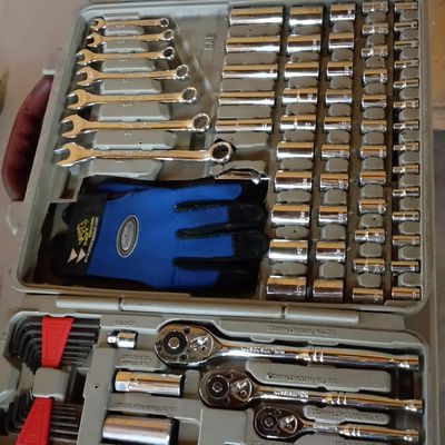 Crescent mechanics tool set featuring a variety of sockets, wrenches, ratchets, screwdrivers, and pliers housed in a grey molded plastic...