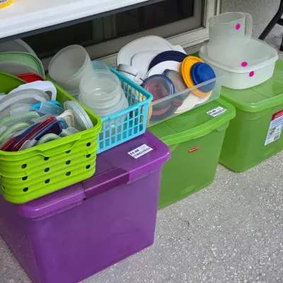 Sale Photo Thumbnail #324: Collection of plastic storage tubs, organization baskets, and Tupperware-style food containers in various colors and sizes.