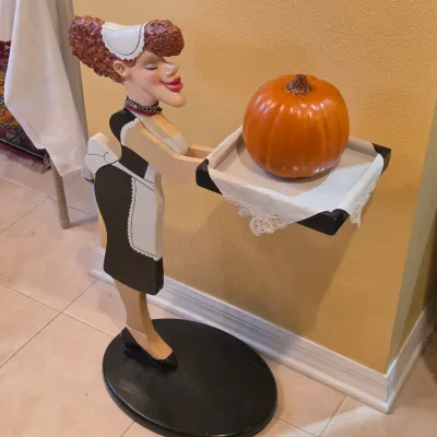 Sale Photo Thumbnail #56: Whimsical wooden French maid butler tray pedestal stand holding a decorative pumpkin.