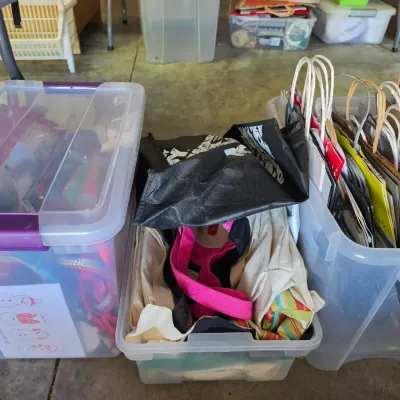 Sale Photo Thumbnail #315: Collection of clear plastic storage totes filled with craft supplies, reusable canvas bags, and paper shopping bags.