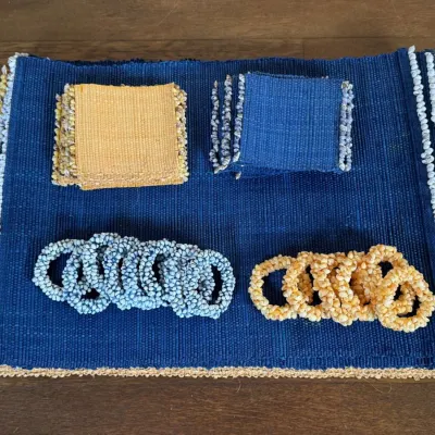 Assortment Of Woven Polypropylene Coasters, Napkin Rings & Placemats - Blue & Yellow Seashell Motif