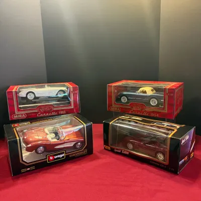Collection of four 1:18 scale die-cast Chevrolet Corvette model cars in their original boxes, including Mira 1953 and 1954 Corvettes, a...