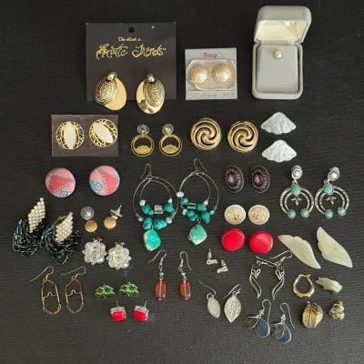 Collection of vintage fashion and fine jewelry, including clip-on and pierced earrings, faux turquoise dangles, Biagi pearl studs, and...