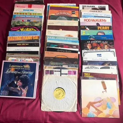 Large collection of vintage vinyl LP records and box sets featuring artists such as Lawrence Welk, Rod McKuen, Perry Como, and Herb Alpert.