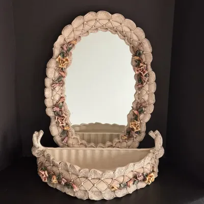 Vintage ceramic wall mirror and matching vanity bowl set, featuring a lattice texture and applied floral accents.