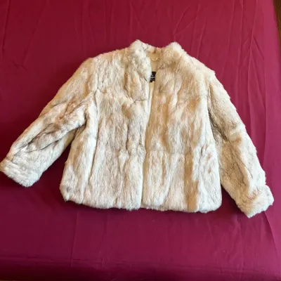Vintage off-white and light brown fur coat with a mandarin-style collar and silk lining.
