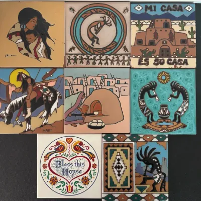 Collection of eight Southwestern hand-painted ceramic art tiles, featuring Native American motifs, Kokopelli designs, and pueblo scenes.