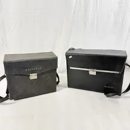 Sale Photo Thumbnail #136: Pair of vintage black Polaroid camera hard carrying cases with shoulder straps, circa 1960s-1970s.