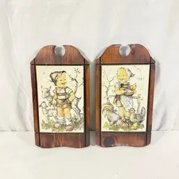 Sale Photo Thumbnail #196: Pair of vintage wooden wall plaques featuring printed ceramic tiles of Hummel-style children with farm animals.