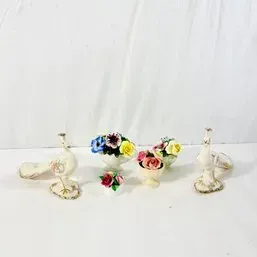 Sale Photo Thumbnail #121: Collection of vintage porcelain floral miniatures and bird figurines, featuring delicate hand-painted roses and ornate details.