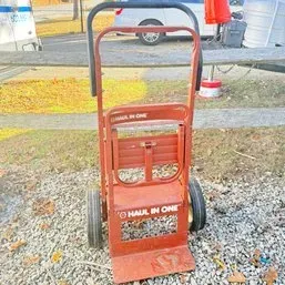 Sale Photo Thumbnail #73: Vintage red Haul-In-One convertible hand truck and dolly with solid rubber wheels, showing light wear.
