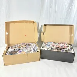 Sale Photo Thumbnail #256: Two shoeboxes filled to capacity with unsorted vintage and modern sports trading cards.
