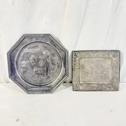 Sale Photo Thumbnail #217: Pair of vintage embossed pewter decorative plaques featuring detailed relief scenes, including one octagonal plate and one rectangular tray.