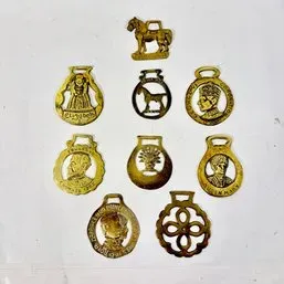 Sale Photo Thumbnail #214: Collection of nine vintage brass horse brasses featuring various equestrian, royal commemorative, and decorative motifs.