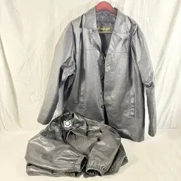 Sale Photo Thumbnail #218: Two black leather coats, including a hanging button-up jacket and a folded jacket, in good pre-owned condition.