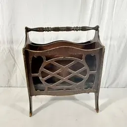 Sale Photo Thumbnail #234: Vintage dark stain wooden magazine rack featuring a turned spindle handle, lattice cut-out sides, and a split interior compartment.