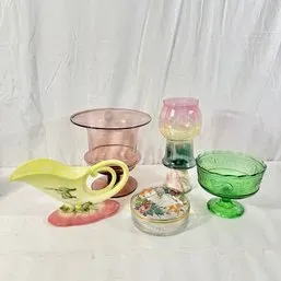 Sale Photo Thumbnail #146: Collection of vintage decorative glassware and porcelain pieces, including a green footed glass dish, a pink tinted pedestal bowl, and a floral ceramic gravy boat.