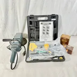Sale Photo Thumbnail #159: Bostitch pneumatic stapler kit with hard carrying case, manual, and accessories, alongside a corded power tool.