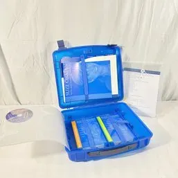 Sale Photo Thumbnail #143: Suze Orman blue plastic financial organizer carrying case containing books and materials.