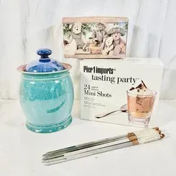Sale Photo Thumbnail #175: Collection of tabletop housewares including a turquoise glazed ceramic jar with blue lid, a Pier 1 Imports Tasting Party set in box, a decorative teddy bear box, and fondue forks.