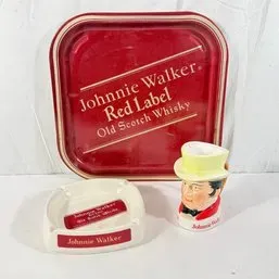 Sale Photo Thumbnail #71: Vintage Johnnie Walker Red Label advertising collectibles, including a red metal tray, a white ceramic ashtray, and a character mini pitcher.