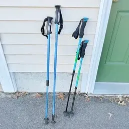 Sale Photo Thumbnail #17: Two pairs of modern adjustable trekking poles with ergonomic grips and wrist straps.