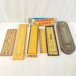 Sale Photo Thumbnail #110: Collection of vintage cribbage boards in various styles and materials, including a vintage Milton Bradley boxed board.