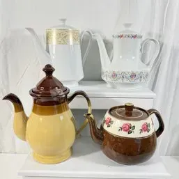 Sale Photo Thumbnail #104: Collection of four vintage ceramic and porcelain teapots and coffee pots in various styles.