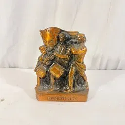 Sale Photo Thumbnail #193: Vintage bronze-tone bookend featuring a relief sculpture of 'The Spirit of '76' depicting Revolutionary War musicians.