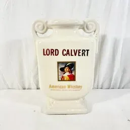Sale Photo Thumbnail #197: Vintage Lord Calvert American Whiskey ceramic urn-shaped decanter with scroll handles and portrait graphic.