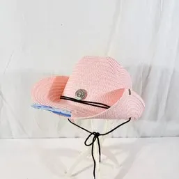 Sale Photo Thumbnail #126: Light pink woven straw cowboy hat featuring a silver-tone concho, black leatherette band, adjustable chin strap, and original tag.
