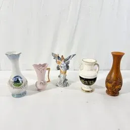 Sale Photo Thumbnail #60: Collection of small decorative porcelain and ceramic items, including mini vases and an angel figurine.