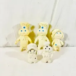 Sale Photo Thumbnail #264: Vintage Pillsbury Doughboy and Poppie Fresh rubber collectible figures set, showing light age-related discoloration.