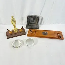 Sale Photo Thumbnail #180: Collection of vintage desk accessories, including wooden double pen stands, a trophy figurine desk set, a heavy stone ornament, and two glass magnifiers.