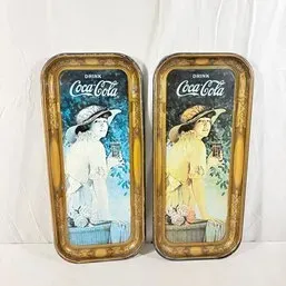 Sale Photo Thumbnail #130: Pair of vintage Coca-Cola metal serving trays featuring nostalgic illustrations of women in hats, showing light surface wear and patina.