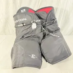 Sale Photo Thumbnail #165: Pair of Easton Synergy S3 ice hockey pants in black and red, featuring padded thighs and waist protection.