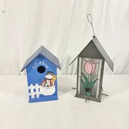 Sale Photo Thumbnail #34: Pair of decorative birdhouses, including a blue painted wooden winter snowman house and a metal house with stained glass tulip panels.