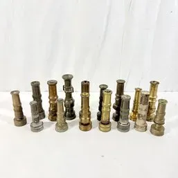 Sale Photo Thumbnail #237: Assortment of vintage brass hose nozzles displaying various patinas and styles.